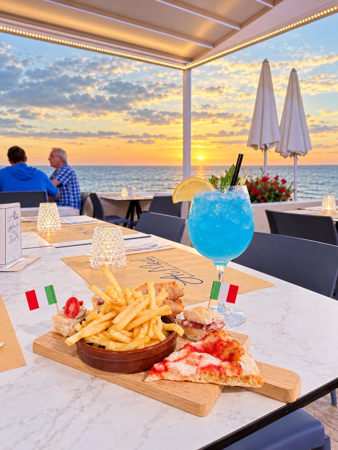 Cocktail e stuzzichini sulla terrazza Ai Medi al tramonto